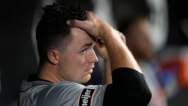 Detroit Tigers starting pitcher Tarik Skubal looks out from dugout...