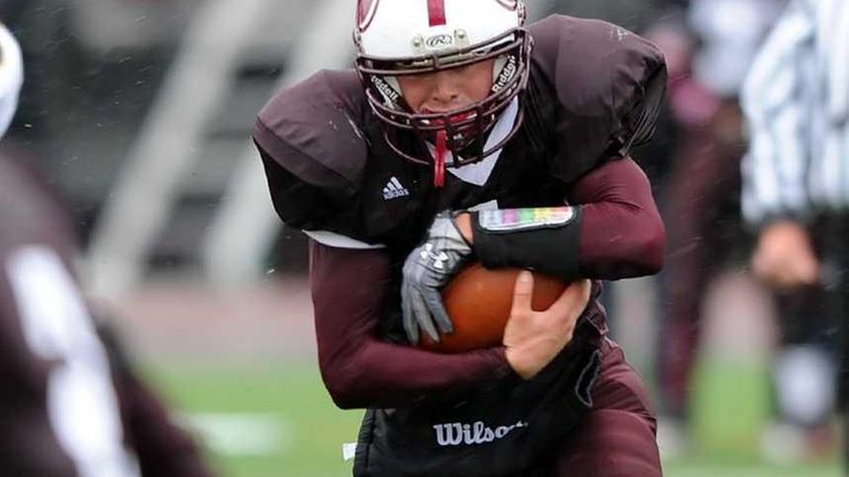 Bay Shore's Lucas Rock (1) drive into the end zone...