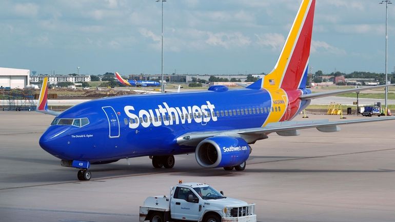 A Southwest Airlines plane moves to departs from Love Field...