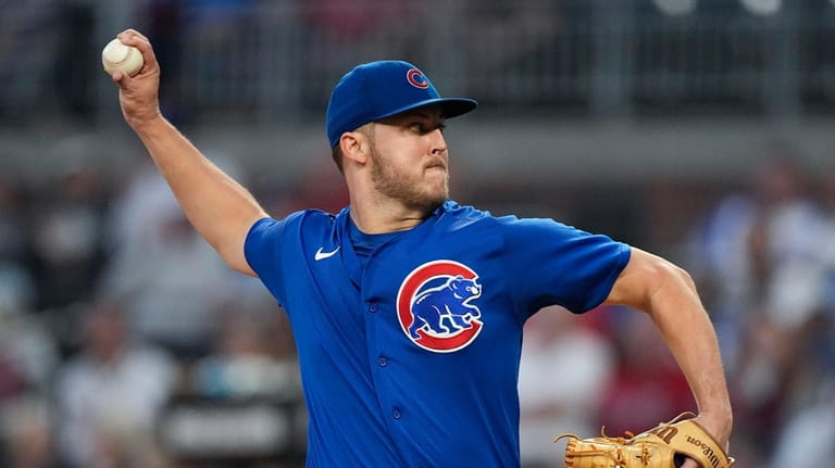 Chicago Cubs starting pitcher Jameson Taillon delivers to an Atlanta...