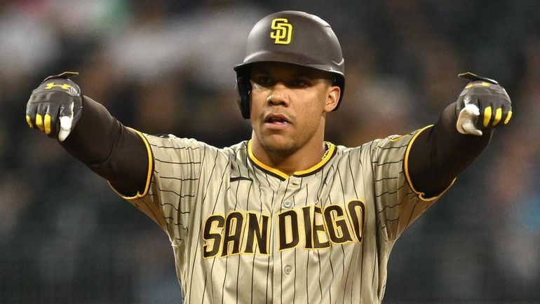 Juan Soto of the Padres reacts after an RBI double in...