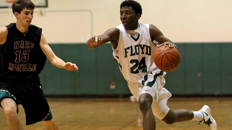 Floyd's Devin Burney drives the outside as Ward Melville's Russell...