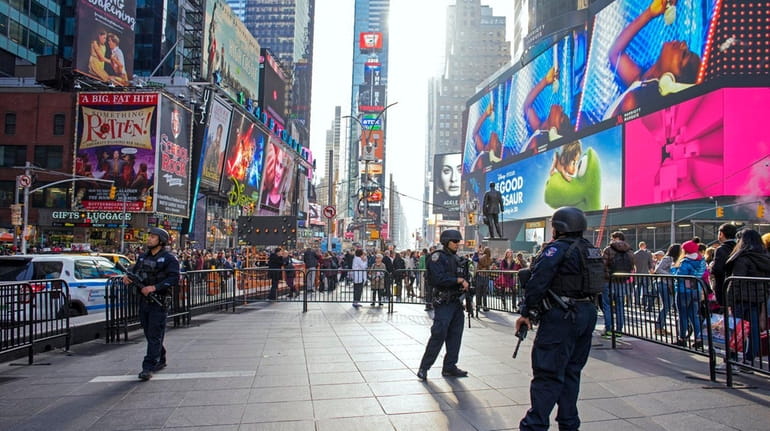 NYPD counterterrorism officers patrol Times Square on Nov. 27. NYPD...