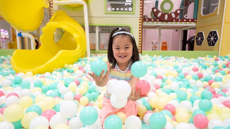 Keira Suh, 4, of Hicksville, plays at Nana's Wonderland in...