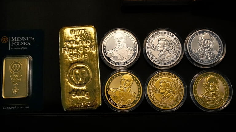 Investment gold and silver are displayed by the Mint of...