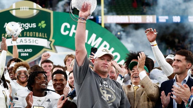 Georgia's head coach Brent Key celebrates with his team after...