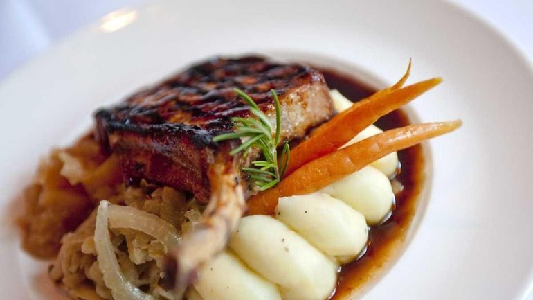 A Berkshire pork chop is served at The Living Room...