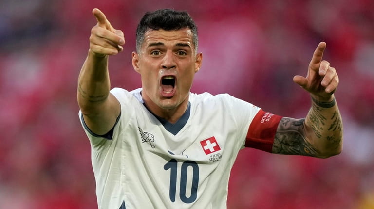 Switzerland's Granit Xhaka reacts during a Group A match between...