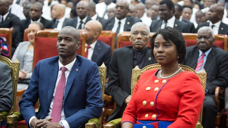 FILE Haiti's President Jovenel Moise sits with his wife Martine...