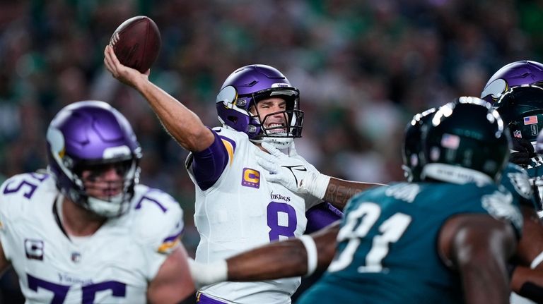 Minnesota Vikings quarterback Kirk Cousins (8) throws during the second...