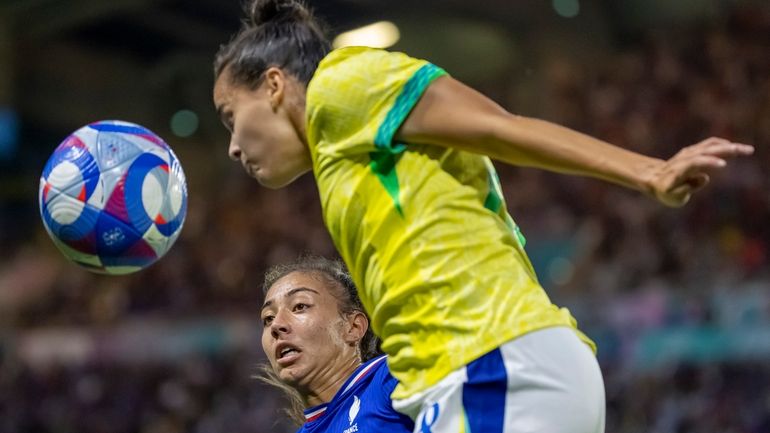 Brazil's Gabi Portilho fights for a head ball with France's...