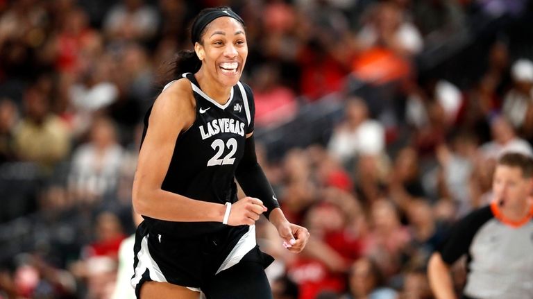 Las Vegas Aces center A'ja Wilson (22) celebrates a play...