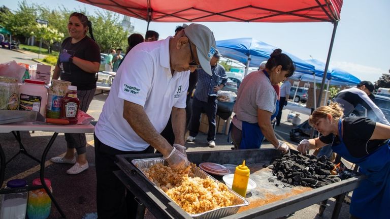 Volunteer Syed Hussain prepares a batch of panipuri at Pakistan...