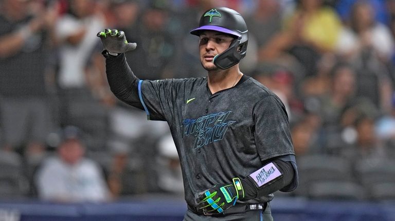 Tampa Bay Rays' Alex Jackson celebrates after his solo home...