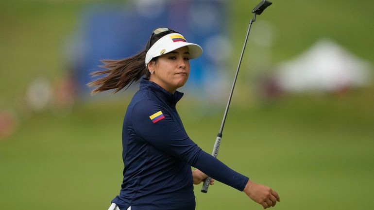 Maria Jose Uribe, of Colombia, reacts after missing a putt...