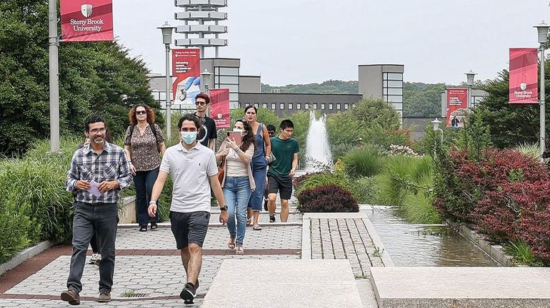 Incoming Stony Brook University students and their parents tour the campus...