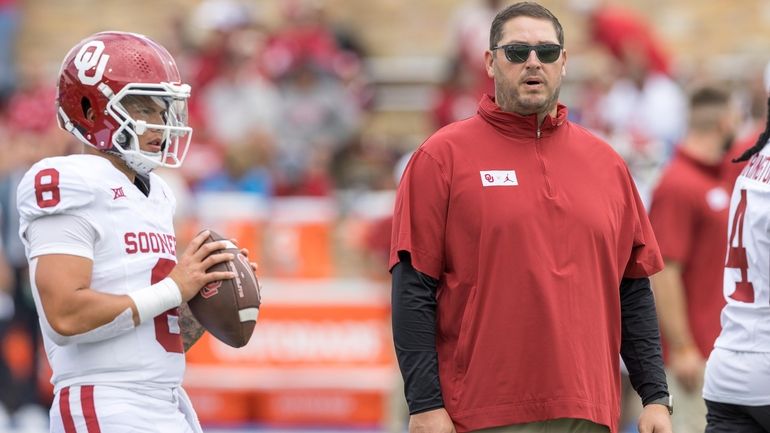 Oklahoma offensive coordinator Jeff Lebby watches quarterback Dillon Gabriel (8)...