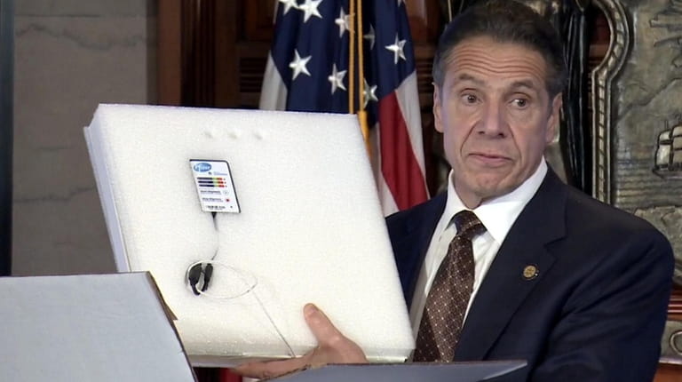 Gov. Andrew M. Cuomo shows a thermal monitor included as...