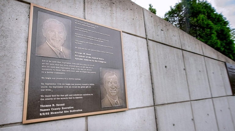 A plaque showing George W. Bush and Thomas Suozzi is...