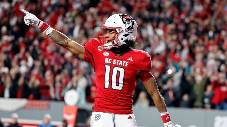 North Carolina State wide receiver Kevin Concepcion (10) celebrates a...