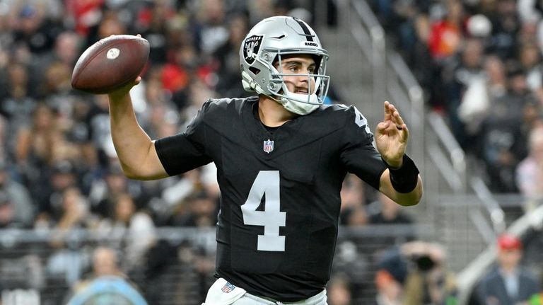 Las Vegas Raiders quarterback Aidan O'Connell (4) passes against the...