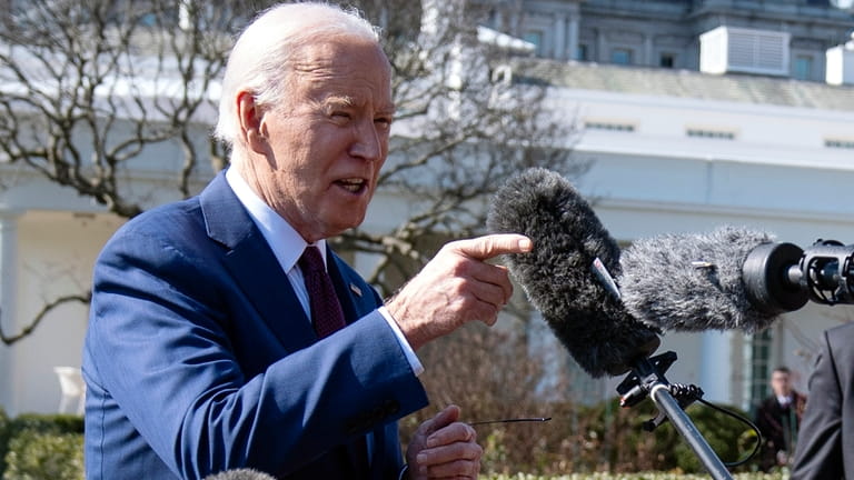 President Joe Biden talks with reporters before boarding Marine One...