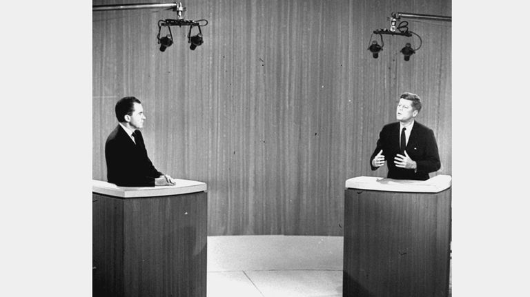 Sen. John F. Kennedy, right, speaks as Vice President Richard...