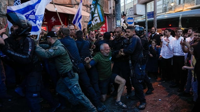 Israeli police push a way members of Brothers and Sisters...