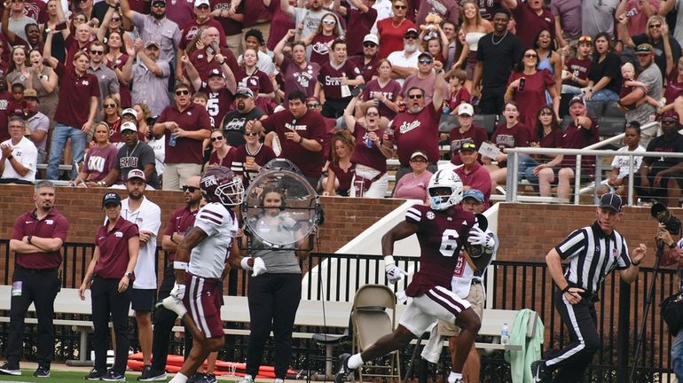 Mississippi State Receiver Jordan Mosley (6) runs down the sideline...