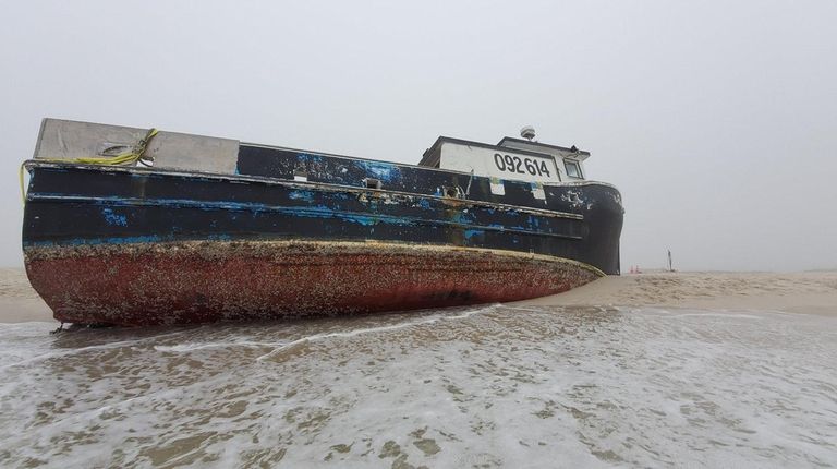 The fishing boat Roger Ventures sits at Jones Beach Field...