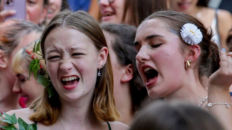 Swifties sing and dance in Vienna on Friday, Aug.9, 2024....