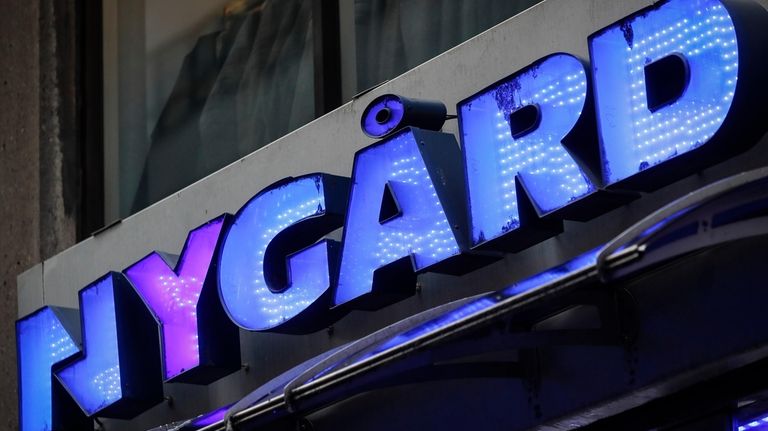 A sign is displayed above the storefront of Peter Nygard's...