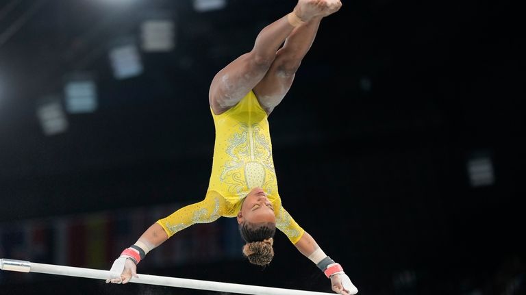 Rebeca Andrade, of Brazil, performs on the uneven bars during...