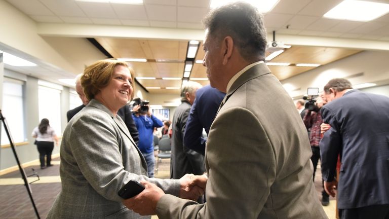 Mayor Jerry Morales speaks with Texas A&M President Katherine Banks...