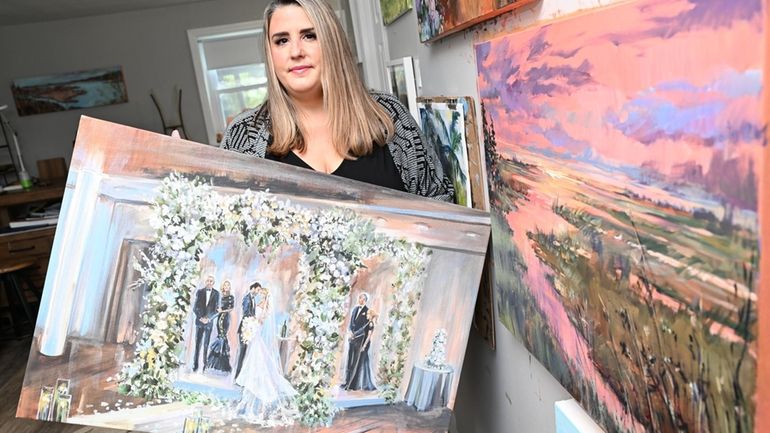 Amanda Hawthorne, in her Massapequa studio on Wednesday, holds a painting she...