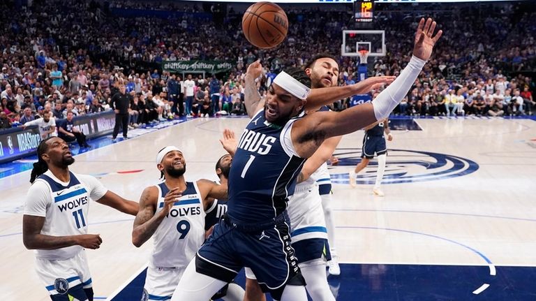 Dallas Mavericks guard Jaden Hardy (1) scores past Minnesota Timberwolves...