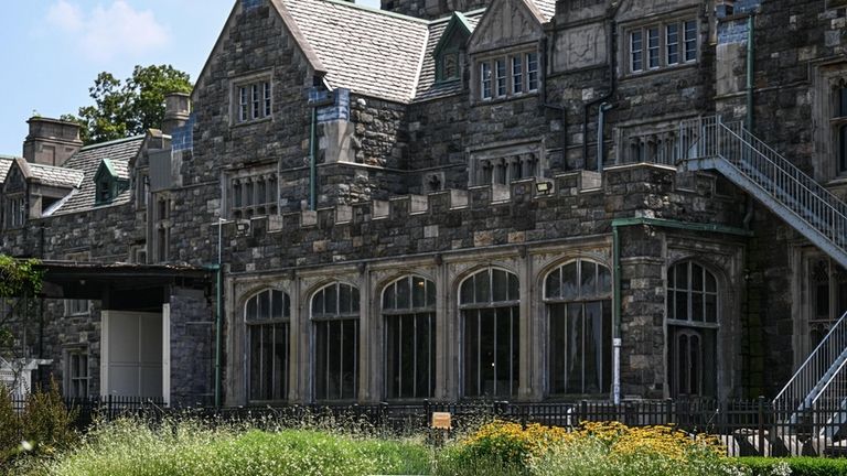 Hempstead House looms over the native garden at the Sands...