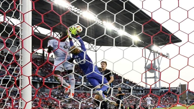 Philadelphia Union goalkeeper Andrew Rick (76) makes a stop against...