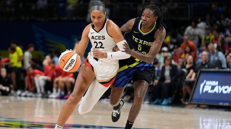 Las Vegas Aces forward A'ja Wilson (22) drives against Dallas...