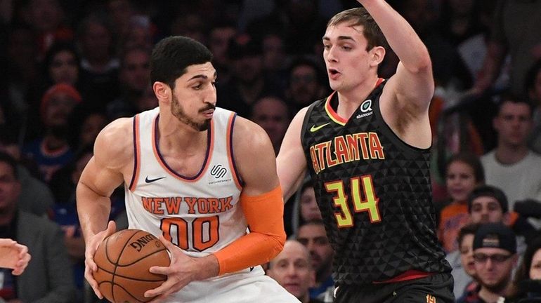 Knicks center Enes Kanter drives the ball against Hawks forward...