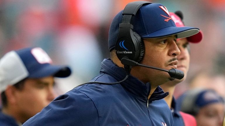 Virginia head coach Tony Elliott watches during the second half...