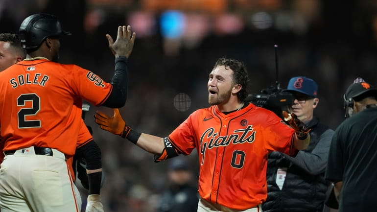 San Francisco Giants' Brett Wisely (0) celebrates with Jorge Soler...