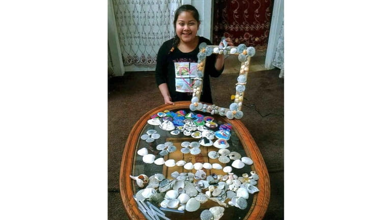 Kidsday reporter Estefani Gomez with her shell collection and decorated...