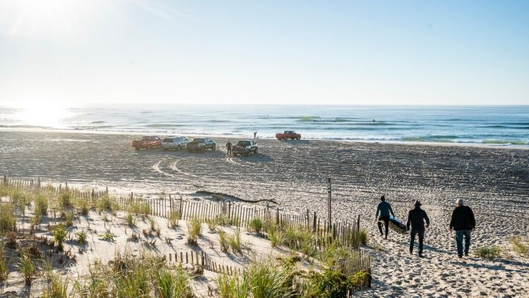 The friends meet up for surf kayaking at Ponquogue Beach...