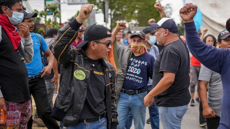 Protesters block the Inter-American Highway in San Lucas Sacatepéquez, Guatemala,...