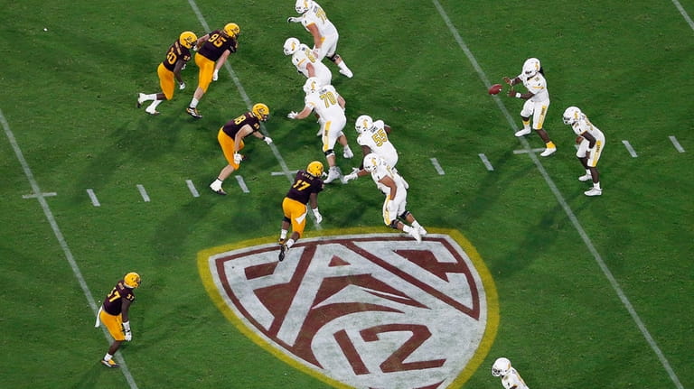 The Pac-12 logo is shown during the second half of...