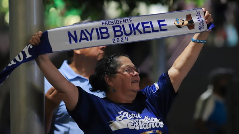 A supporter of Salvador President Nayib Bukele, who is seeking...