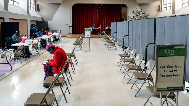 A woman at a Washington, D.C., church fills out a...