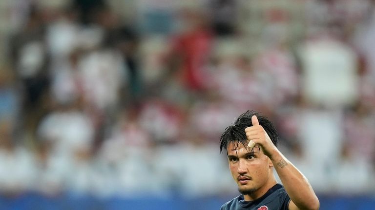 England's Marcus Smith gestures to the fans after the end...