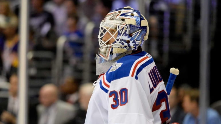 Henrik Lundqvist of the Rangers looks on against the Los...